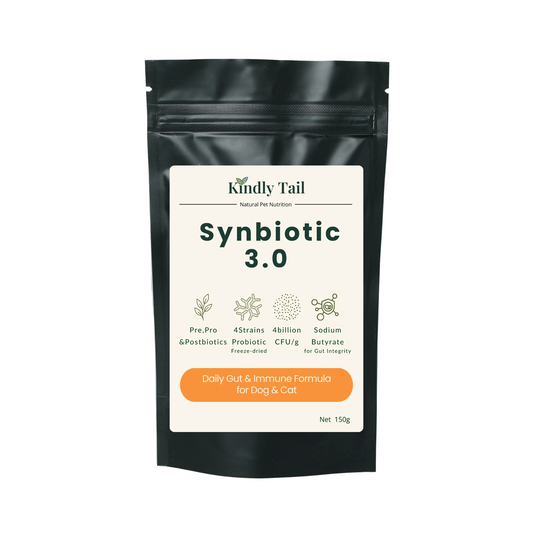 A black stand-up pouch of Kindly Tail Synbiotic 3.0 pet supplement, featuring a cream label with green text and icons, set against a light blue-gray background.