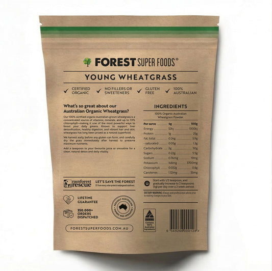 Back view of a kraft paper bag of Forest Super Foods Young Wheatgrass powder, showing product details, ingredients, and a barcode on a white background.