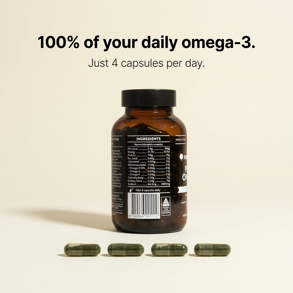 Vitamin supplement bottle with capsules on a beige background